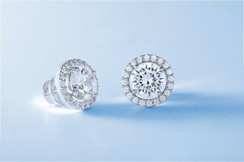 Close-up of luxurious diamond earrings showcasing exquisite design.